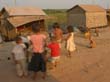 44. Жителей деревни не смущает наличие дороги прямо на выходе из дома. Тут же моются, стираются, тут же играют дети.